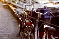 Two classic retro bicycles on cobblestone path