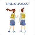 Two classmates, classfellows or friends walk to school and talk or chat.Pair of girls or female students or pupils with schoolbags