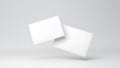 Two clean white blank paper cards floating in a minimalist studio with soft lighting and subtle shadows Royalty Free Stock Photo