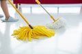 Two cleaners with mop cleaning marble floor outdoors. Cleaning service Royalty Free Stock Photo