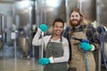 Two Cleaning Workers Smiling at Camera Royalty Free Stock Photo