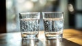 Refreshing: Two glasses filled with sparkling water sit side-by-side bubbles creating a visually appealing Royalty Free Stock Photo