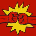 Two clenched fists bumping together on pop art comic burst background. The concept of conflict, confrontation Royalty Free Stock Photo