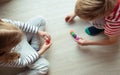 Two clever children study mathematics playing with colorful dices Royalty Free Stock Photo