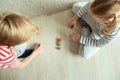 Two clever children study mathematics playing with colorful dices Royalty Free Stock Photo