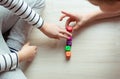 Two clever children study mathematics playing with dices on the floor Royalty Free Stock Photo