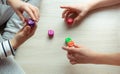 Two clever children study mathematics playing with dices on the floor Royalty Free Stock Photo