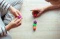 Two clever children study mathematics playing with dices on the floor Royalty Free Stock Photo