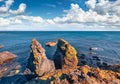 Two cliffs on the shore of small fishing village Arnarstapi or Stapi, Iceland, Europe.