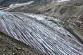 Two climber, hiker climbing on the Tre-la-Tete glacier in French Alps, near the Domes-de-Miage towards Mont Blanc, on summer day Royalty Free Stock Photo