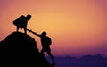 Two climbers on mountain peak on sunset Royalty Free Stock Photo