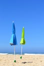 Two closed parasols on the beach Royalty Free Stock Photo