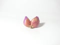 two cloves of red onion on a white background Royalty Free Stock Photo