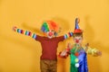 Two clowns hug and wave their arms around Royalty Free Stock Photo