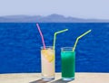Two cocktails on marble table at beach Royalty Free Stock Photo