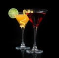 Two cocktails red cosmopolitan cocktail on a black background Royalty Free Stock Photo