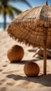 Two coconuts under a straw umbrella on a sandy beach. Royalty Free Stock Photo