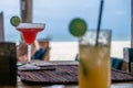 Two coctails in beach bar, beach and ocean in background Zanzibar Royalty Free Stock Photo