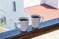 Two coffee cup coffee cups in wooden balcony terrace