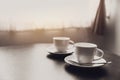 Two coffee cups on table at windows morning Royalty Free Stock Photo