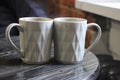 Two coffees in white cups on the wooden table. Love and relationship concept Royalty Free Stock Photo