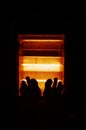 Two cold feet in front of a small heater, in winter