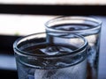 Two cold water glass with ice cubes, Water drops, Close up & Macro shot, Selective focus, Healthy Drink concept Royalty Free Stock Photo