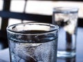 Two cold water glass with ice cubes, Water drops, Close up & Macro shot, Selective focus, Healthy Drink concept Royalty Free Stock Photo