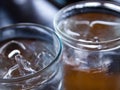 Two cold water glass with ice cubes, Water drops, Close up & Macro shot, Selective focus, Healthy Drink concept Royalty Free Stock Photo