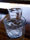 Two cold water glass with ice cubes, Water drops, Close up & Macro shot, Selective focus, Healthy Drink concept Royalty Free Stock Photo