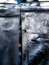 Two cold water glass with ice cubes, Water drops, Close up & Macro shot, Selective focus, Healthy Drink concept Royalty Free Stock Photo