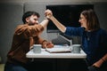 Two colleagues celebrating success with a high five in a modern office.