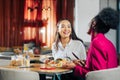 Two colleagues having tasty lunch together during break Royalty Free Stock Photo