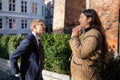 Two colleagues, man and woman discuss over a working project outdoors Royalty Free Stock Photo