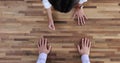 Two colleagues misunderstand disagreement and conflict stand in modern workplace face to face leaning hands on table