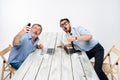 Two colleagues taking the picture to them self sitting in office Royalty Free Stock Photo