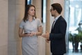 Two colleagues talking meet in modern office hallway Royalty Free Stock Photo