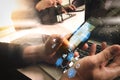 two colleagues website designer discussing data and digital tablet and computer laptop with graphics design diagram on marble de Royalty Free Stock Photo
