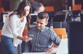 Young Casual business couple using computer in the office. Coworking, Creative manager showing new startup idea Royalty Free Stock Photo