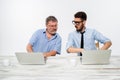 The two colleagues working together at office on white background Royalty Free Stock Photo
