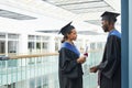 Two college graduates chatting Royalty Free Stock Photo