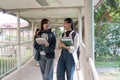 Two college student female friends smile ready for class at the university campus Royalty Free Stock Photo