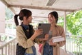 Two college student female friends smile ready for class at the university campus Royalty Free Stock Photo