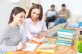 Two college students studying together at home Royalty Free Stock Photo