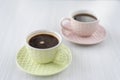 Two color cups of coffee on the table Royalty Free Stock Photo