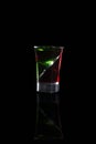 Two color double alcoholic short drink isolated on black background