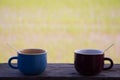 Two color coffee cups on wooden Royalty Free Stock Photo