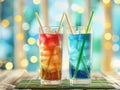 Two color fresh drink in tall glass with bamboo straw on blurred background