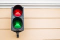 Two-color traffic light on the wall.