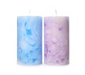Two color wax candles on white Royalty Free Stock Photo